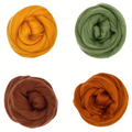 Four balls of yarn in orange, green, brown, and rust on a white background